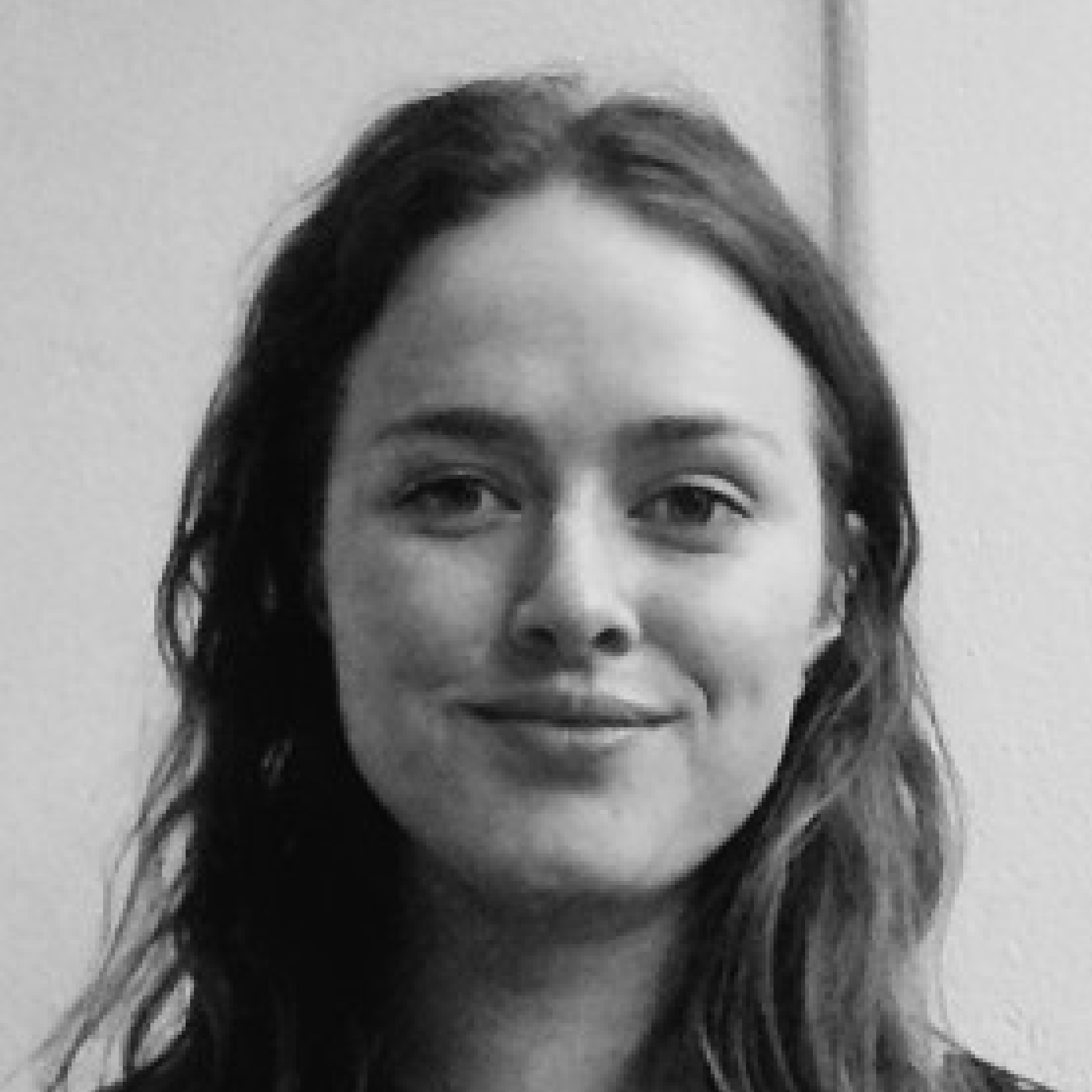 Young woman smiling in black and white.