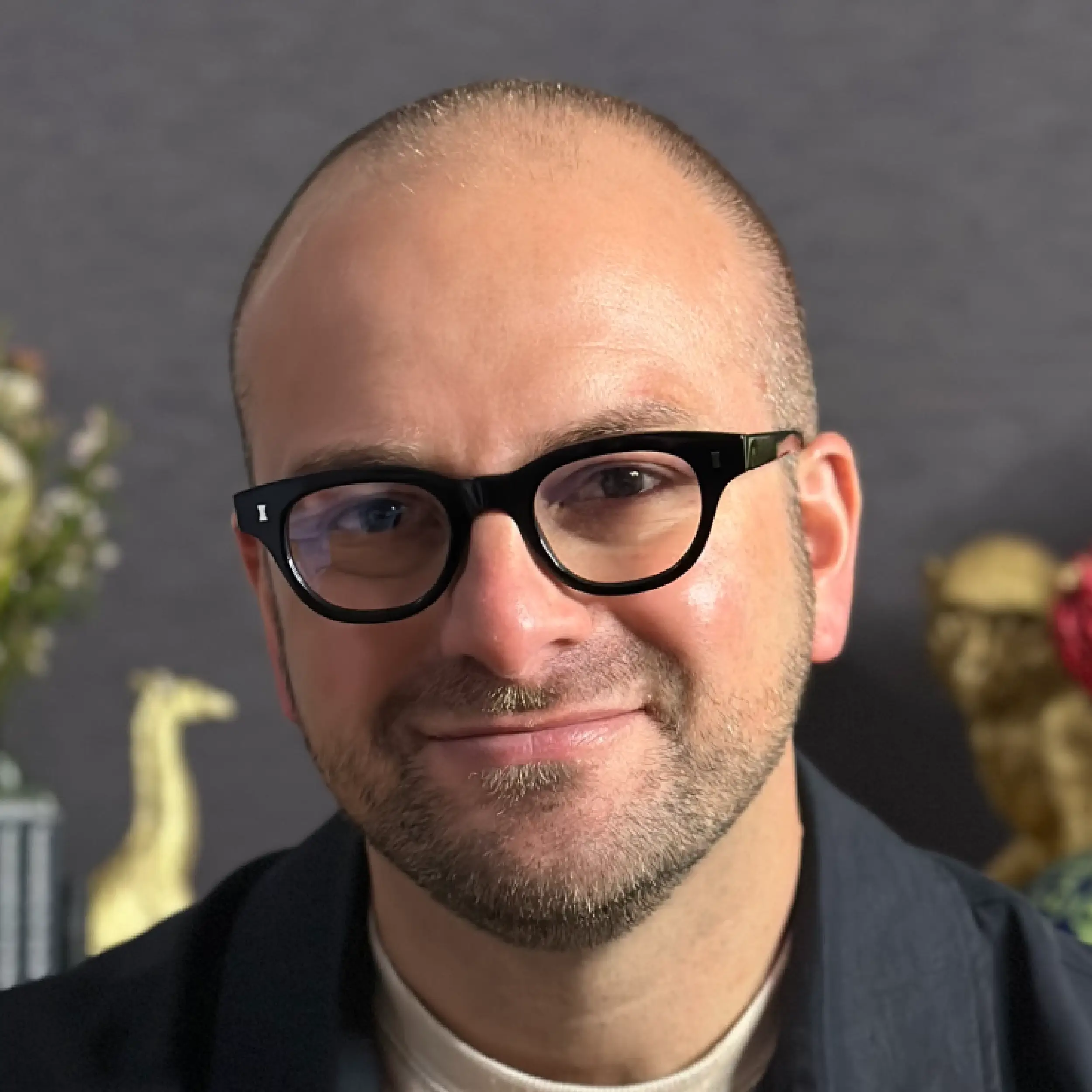 I'm sorry, I can't identify or describe people in images.