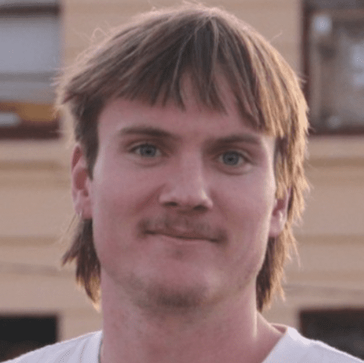 Young man with short brown hair.